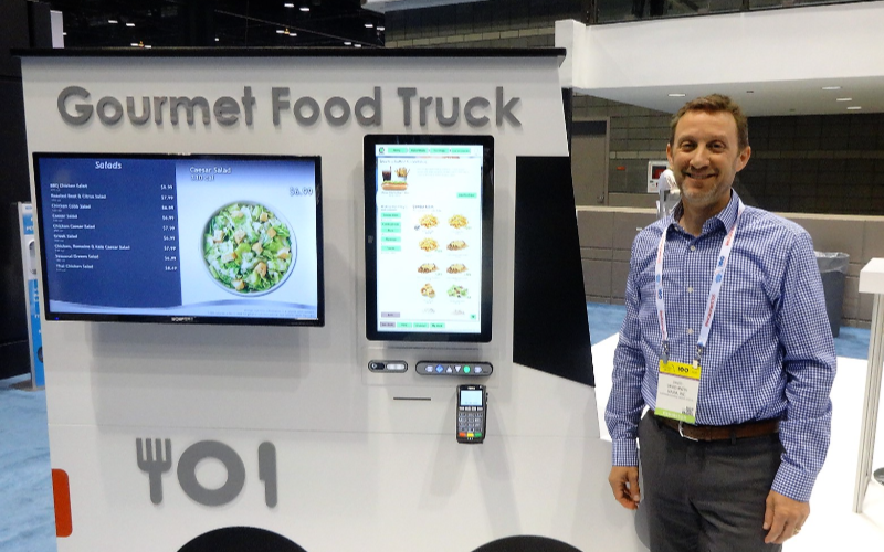 Combining Self-service Kiosks and Staff Assistance